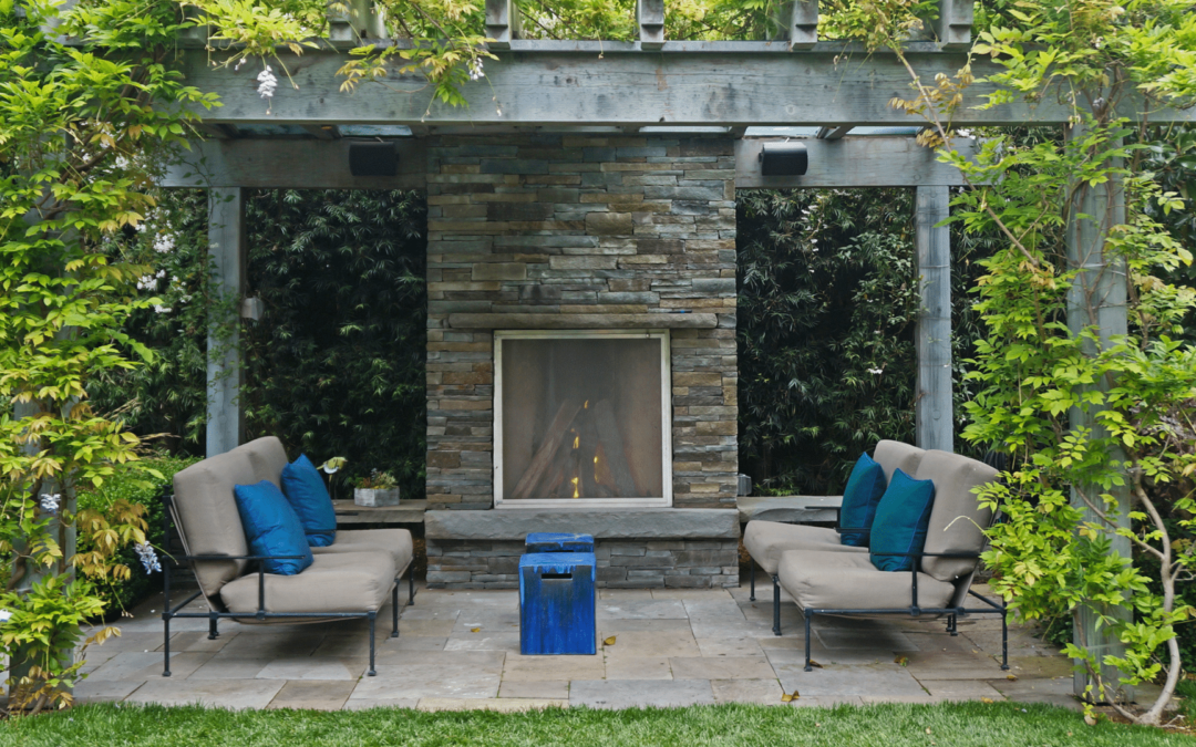 Pergola with fireplace and outdoor seating