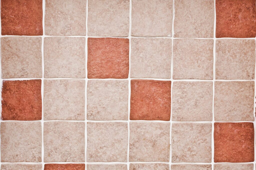 A pattern of red and beige kitchen tile, demonstrating one of the four best types of kitchen tile